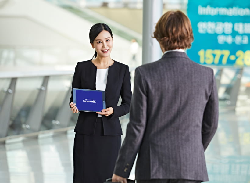 Concierge holding a signboard welcoming a VIP client.