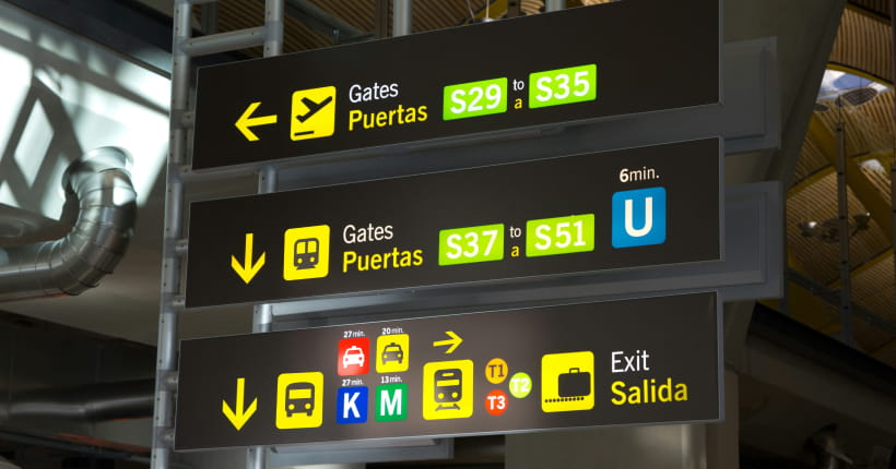 Airport sign with gate numbers and baggage claim information.