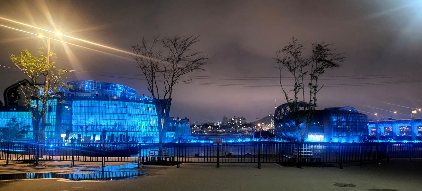 Sevit Floating Islands glowing blue, illuminating the night.