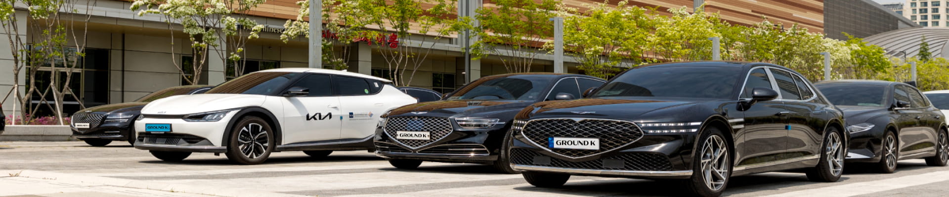 Protocol vehicles with GroundK license plates parked in a row.