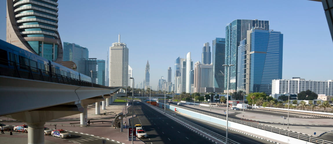 Dubai’s skyline and metro during the day, perfect for high-end travel and business services.