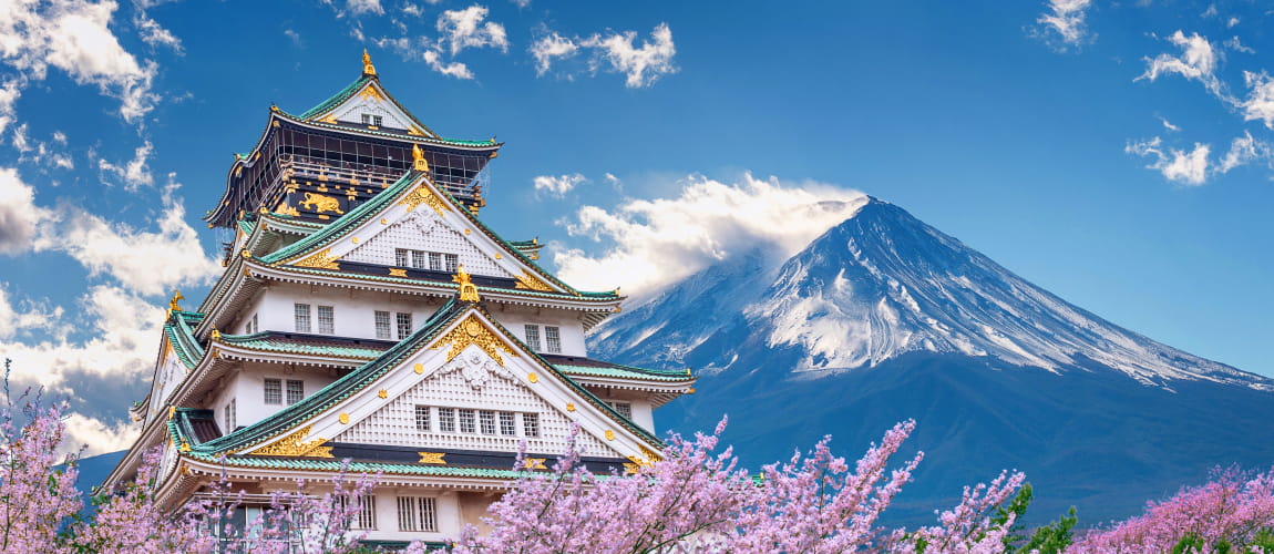 Osaka Castle and cherry blossoms with Mount Fuji, iconic for luxury Japanese travel.