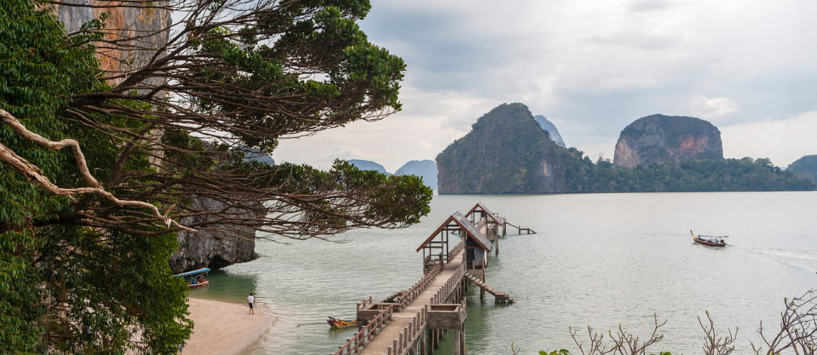 Phang Nga Bay’s scenic pier and limestone islands, ideal for nature travel experiences.