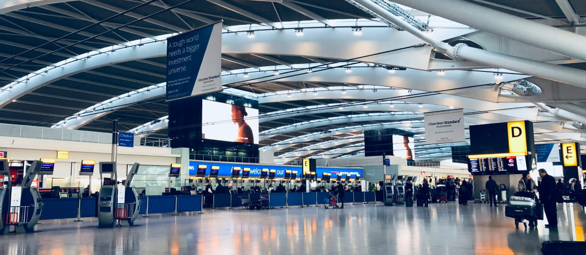 Inside view of Incheon Airport terminal, showcasing the modern architecture and bustling atmosphere ideal for global travel services.