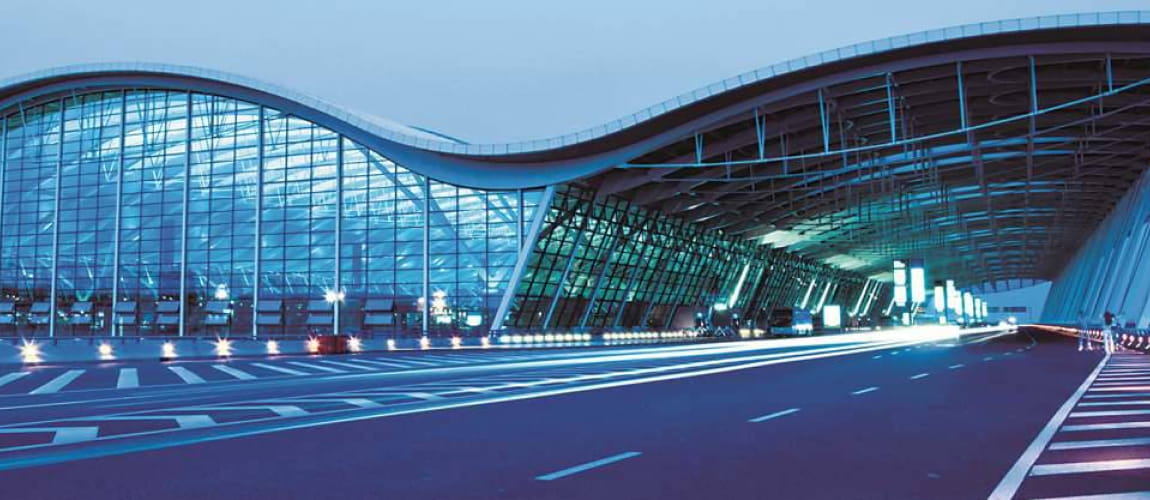 Shanghai Pudong Airport terminal, showcasing modern architecture for global travel services.