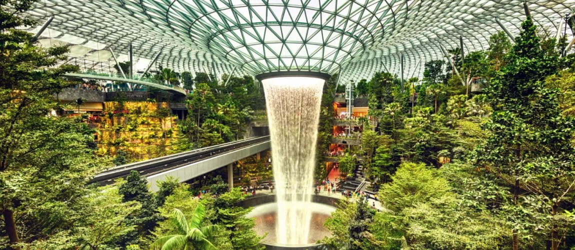 Singapore Changi Airport's Jewel with Rain Vortex and greenery, highlighting unique airport experiences and luxury travel.