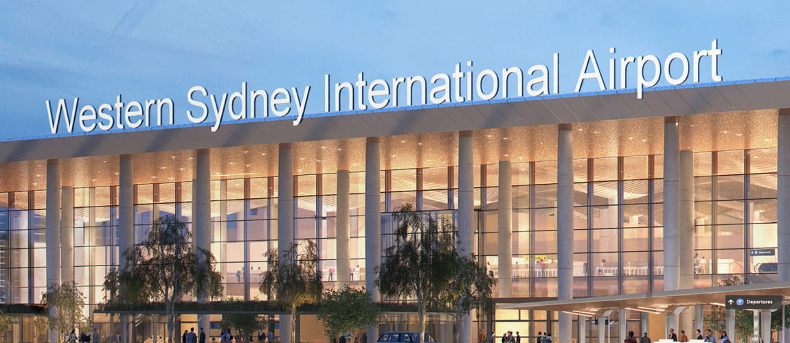 Western Sydney International Airport terminal at dusk, ideal for premium transfer services.