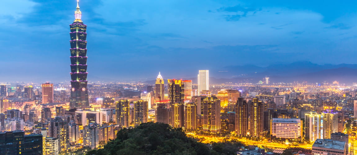 Taipei 101 lighting up the night sky, ideal for luxury city travel and concierge.