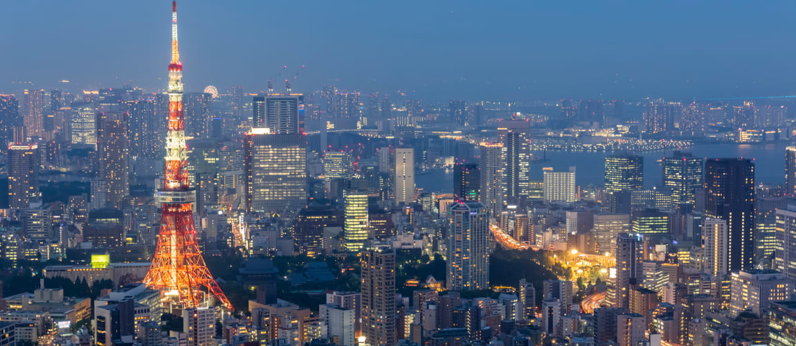 Tokyo Tower illuminated at night, ideal for luxury city chauffeur and concierge services.